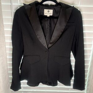 Chic & Stylish Altuzarra Black Peplum Blazer. Satin lapel detail. Front pockets.